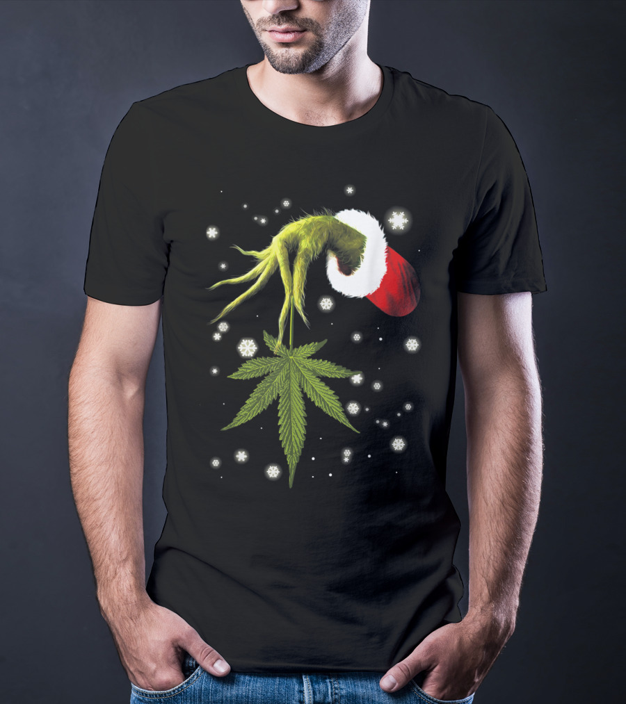 Grinch Hand Holding Cannabis Leaf With Santa Hat And Snowflakes T-Shirt