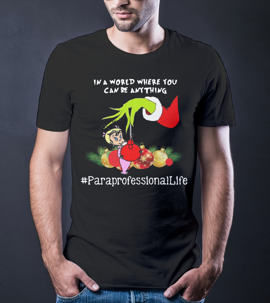 In A World Where You Can Be Anything Hand Grinch Holding Ornaments #ParaprofessionalLife T-Shirt