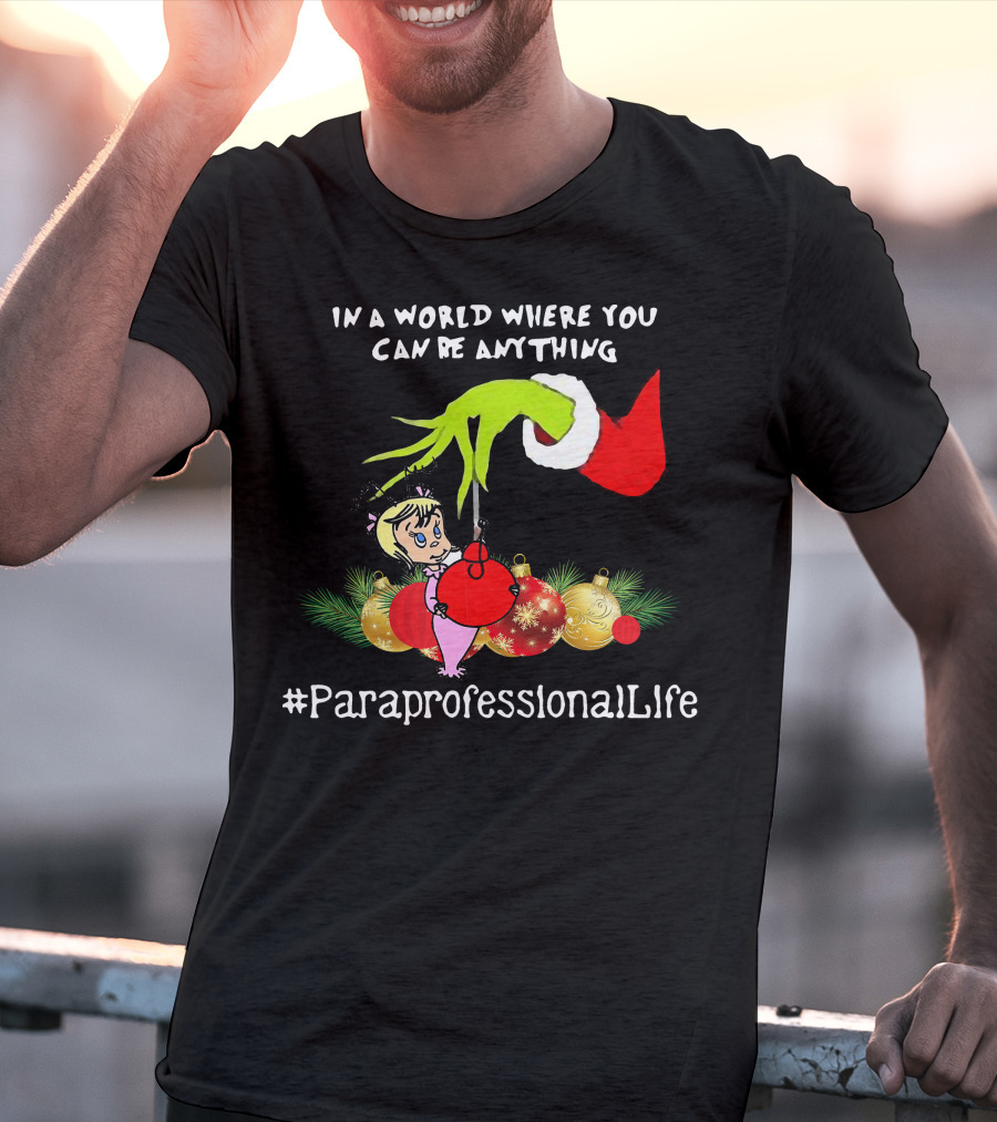 In A World Where You Can Be Anything Hand Grinch Holding Ornaments #ParaprofessionalLife T-Shirt