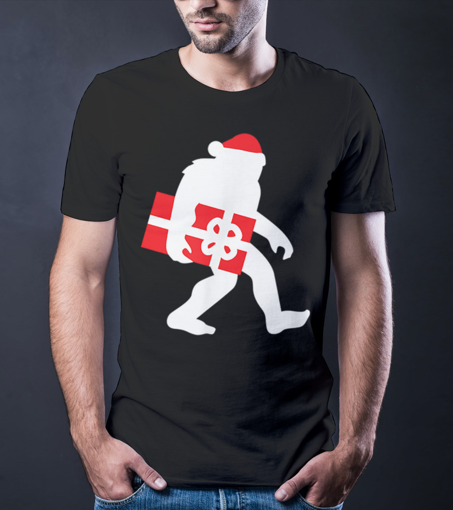 Nice Bigfoot Carrying Christmas Gift In Santa Hat T-Shirt