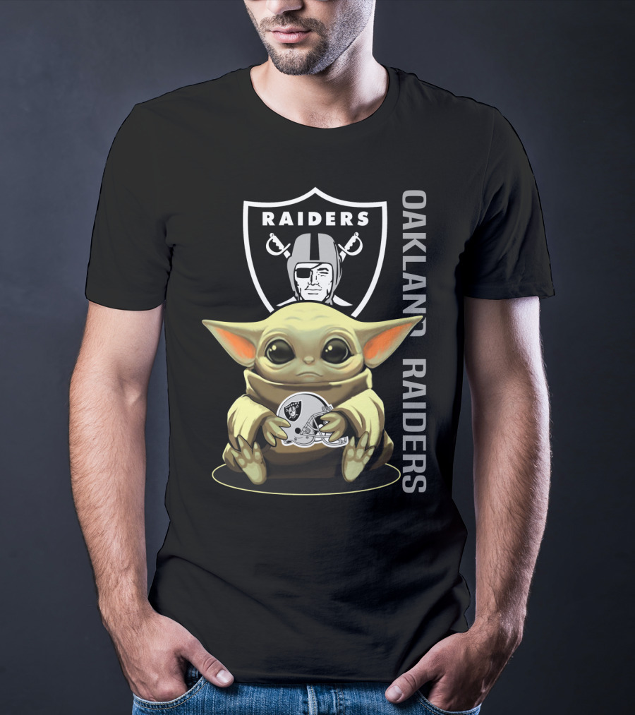 Baby Yoda Holding Oakland Raiders Helmet With Raiders Logo In Background T-Shirt