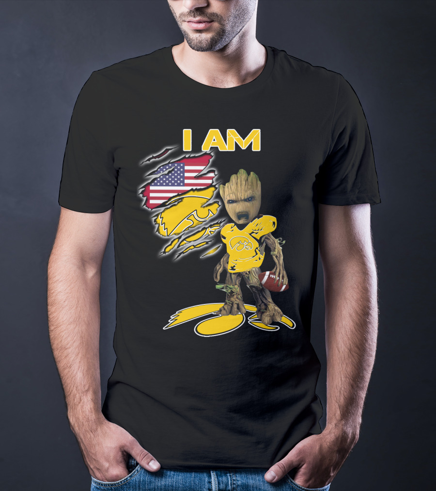 I Am Hawkeyes Baby Groot Holding Football With Usa Flag And Iowa Hawkeyes T-Shirt