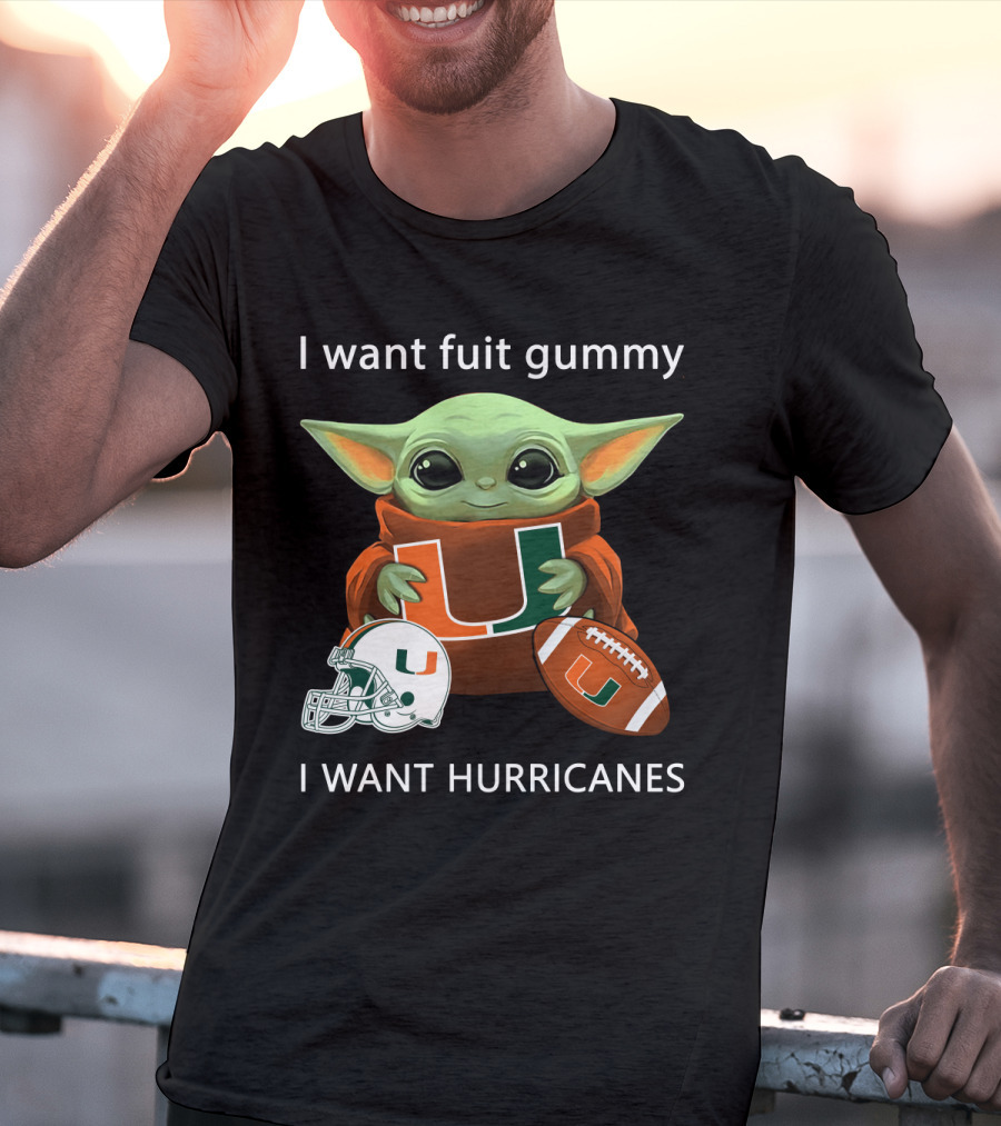 I Want Fuit Gummy I Want Hurricanes Baby Yoda Holding Miami Hurricanes Logo Helmet And Football T-Shirt