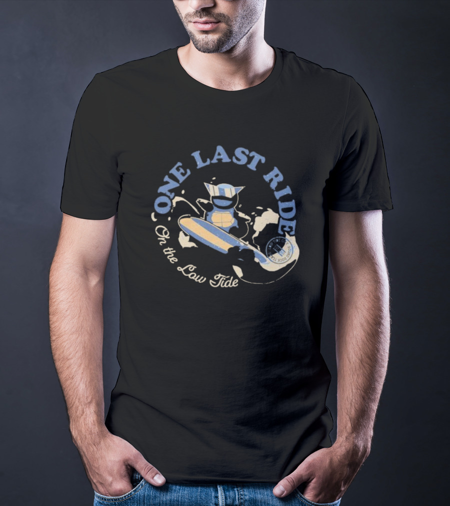 Surfing Adventure With Blue Masked Figure And Iconic Board 'One Last Ride On The Low Tide' T-Shirt