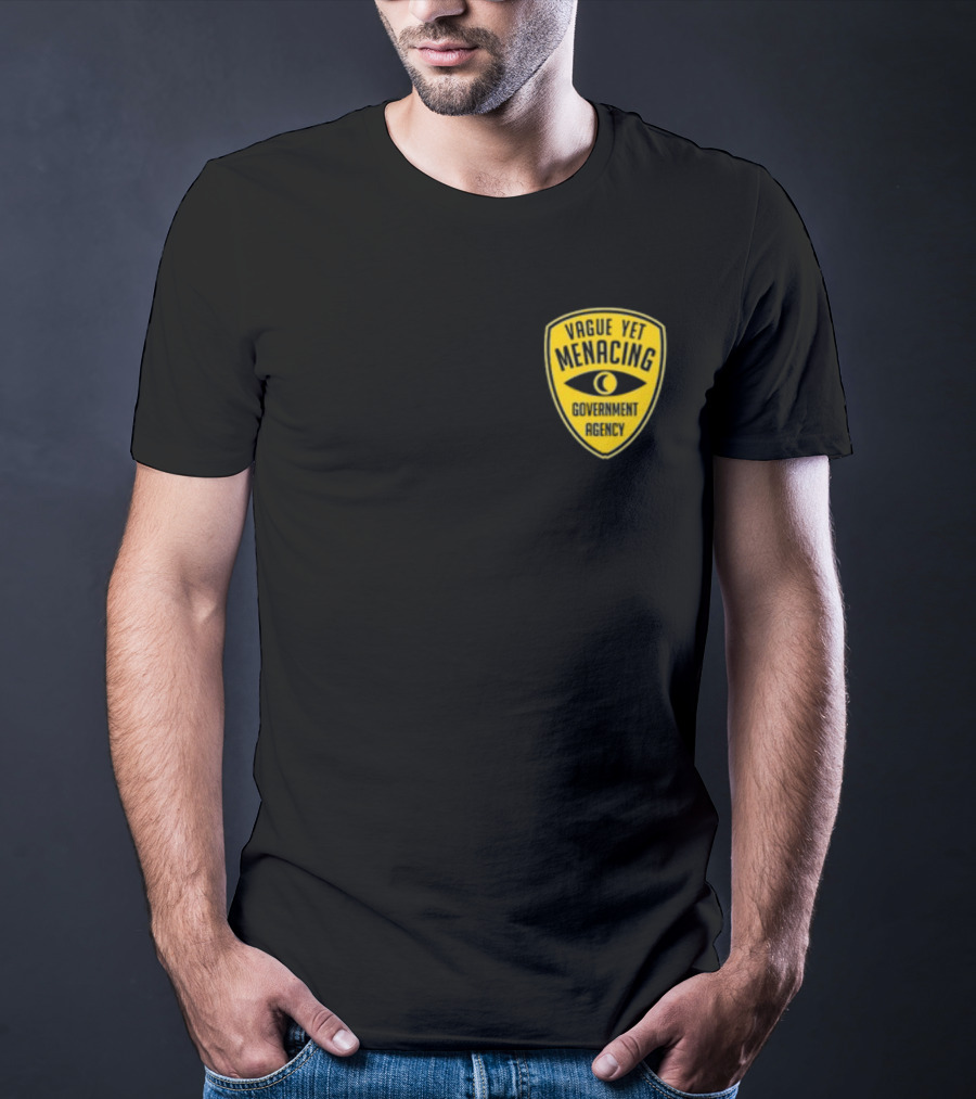 Vague Yet Menacing Government Agency Yellow Badge With Eye T-Shirt