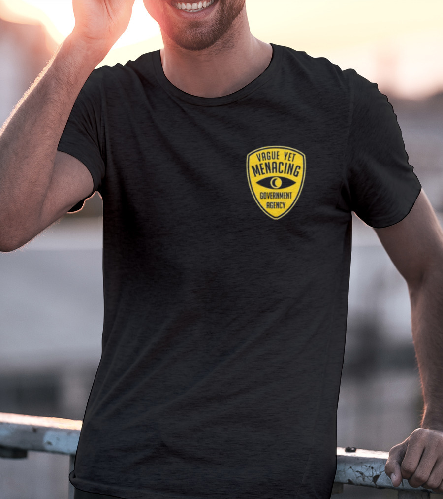 Vague Yet Menacing Government Agency Yellow Badge With Eye T-Shirt
