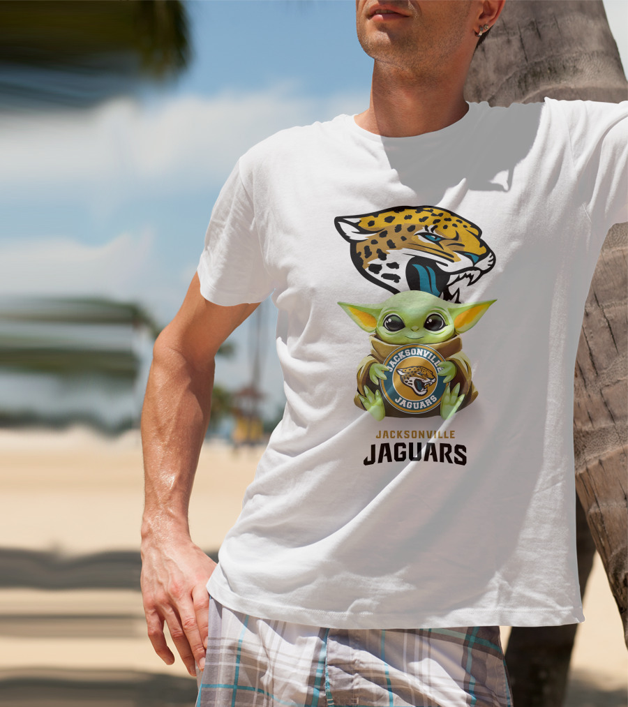 Grogu Holding Jacksonville Jaguars Badge With Mascot In Background T-Shirt