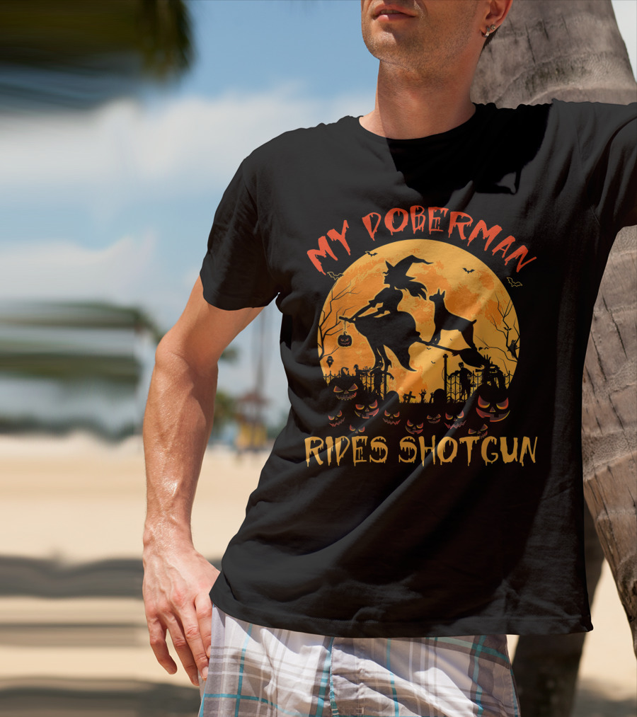 My Doberman Rides Shotgun Halloween Witch And Pumpkins Moon Scene T-Shirt