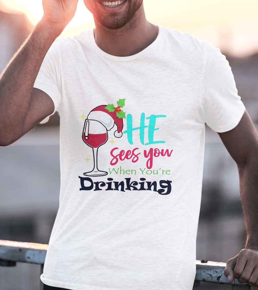 Santa Hat On Wine Glass With 'He Sees You When You're Drinking' Christmas Festive T-Shirt