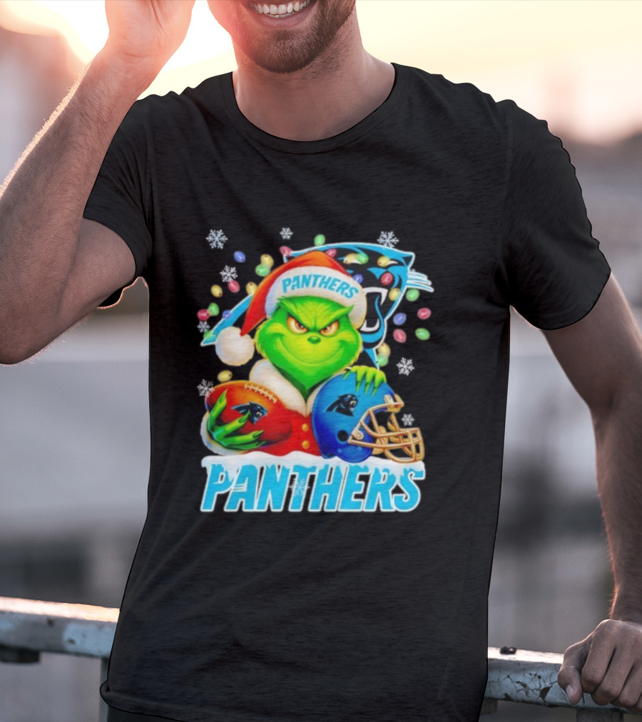 Grinch Santa Hat Holding Carolina Panthers Football And Helmet Merry Christmas T-Shirt