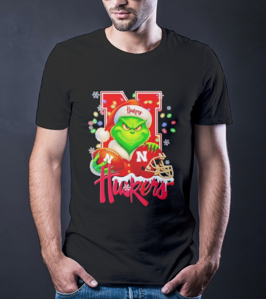 Grinch Santa With Nebraska Cornhuskers Helmet And Football Merry Christmas Huskers T-Shirt