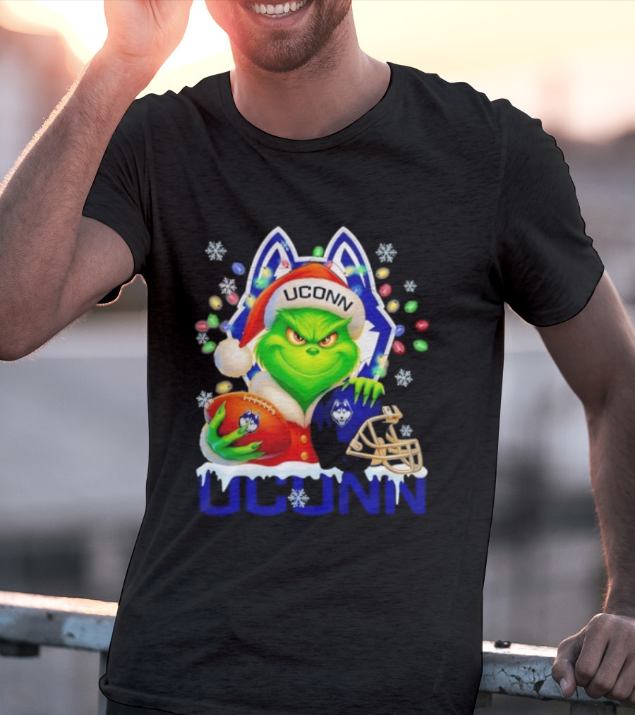 Grinch Wearing Santa Hat With UConn Huskies Football And Helmet Merry Christmas T-Shirt