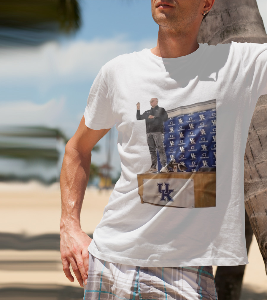 UK Volleyball Coach Craig Skinner Standing On Table With UK Logo And Awards T-Shirt
