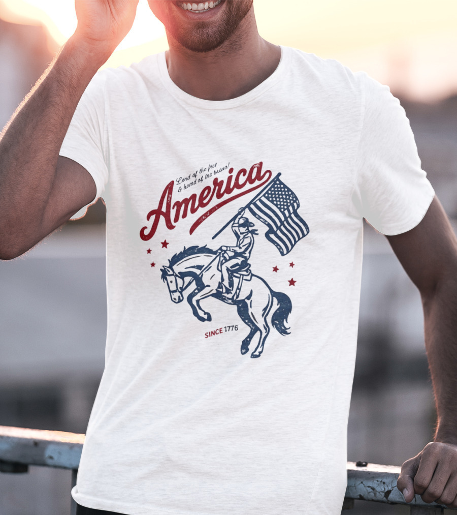 America Land Of The Free Home Of The Brave Since 1776 Cowboy Holding Flag Patriotic T-Shirt