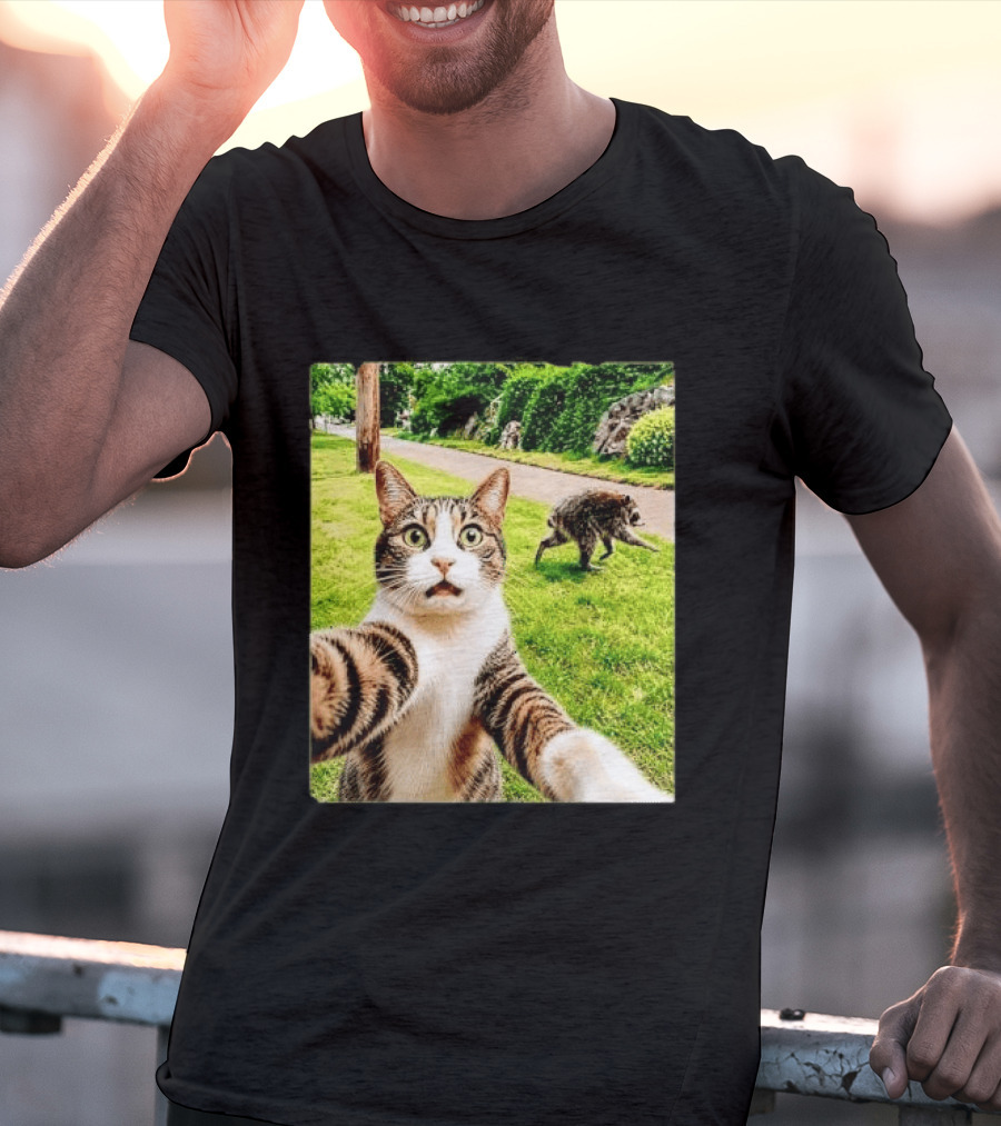 Shocked Face Tabby Cat Taking Selfie With Running Raccoon On Lawn Road T-Shirt