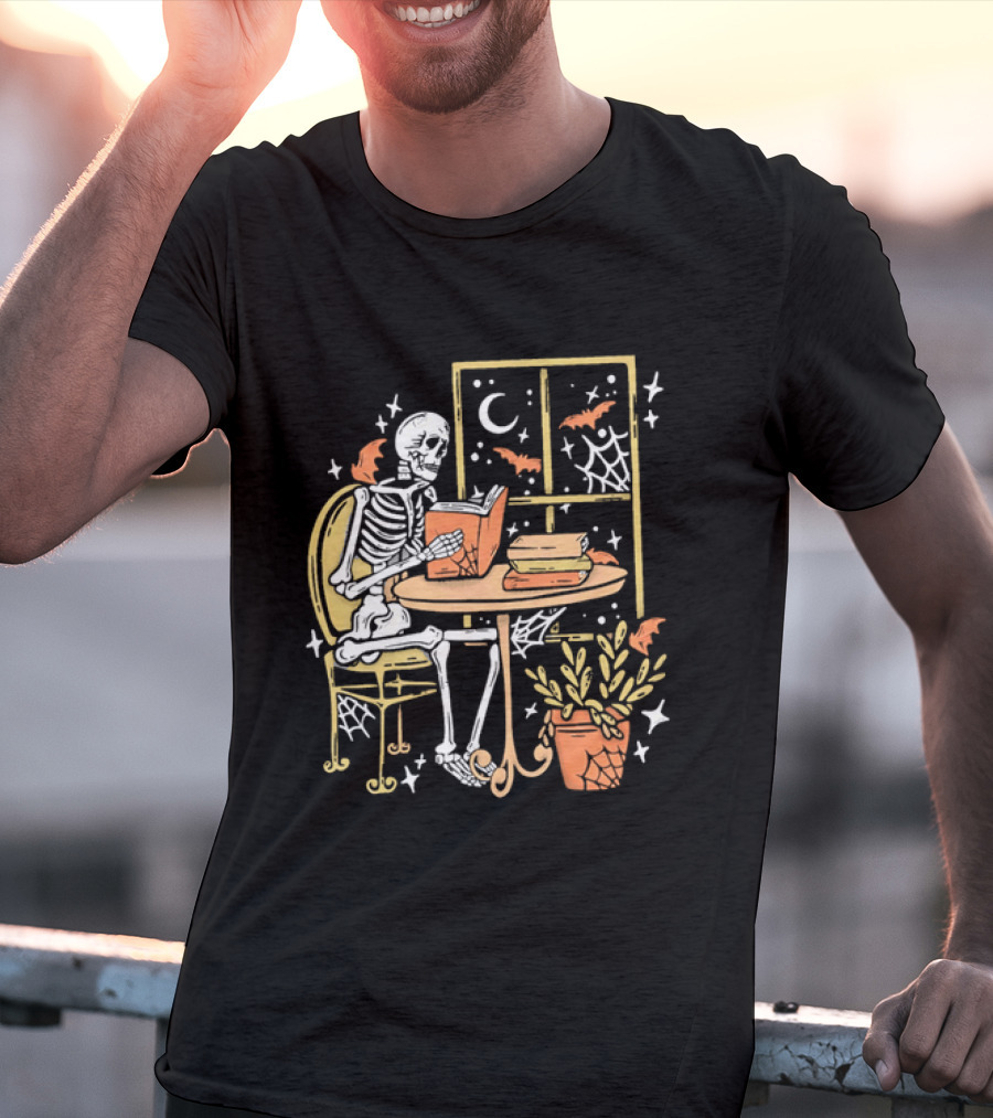 Cartoon Skeleton Reading Under Crescent Moon With Bats Orange Book Table Window T-Shirt
