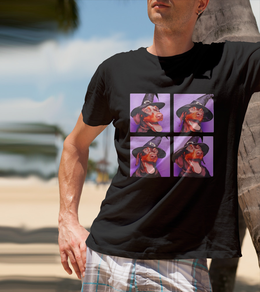 Doberman Pinscher In Witch Hat For Halloween With Purple T-Shirt