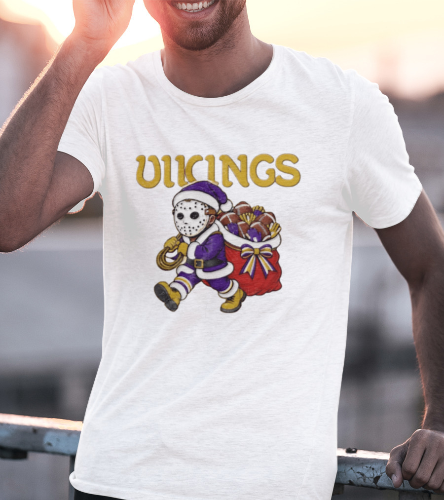Minnesota Vikings Football Christmas Purple And Gold Santa Carrying Footballs T-Shirt