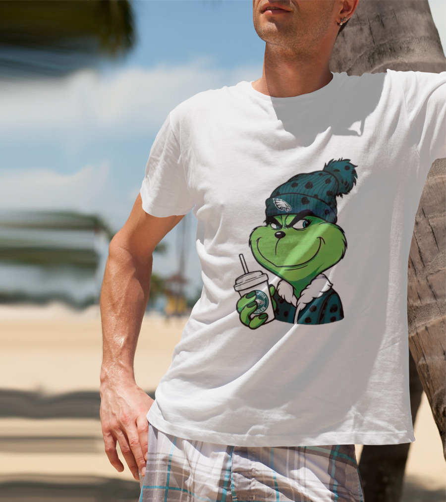 Grinch Holding Cup Wearing Philadelphia Eagles Beanie T-Shirt