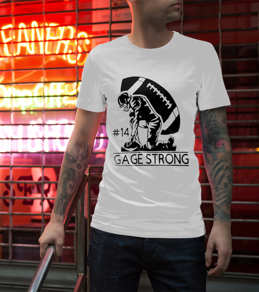 Gage Strong #14 Football Player Kneeling In Front Of Large Football T-Shirt