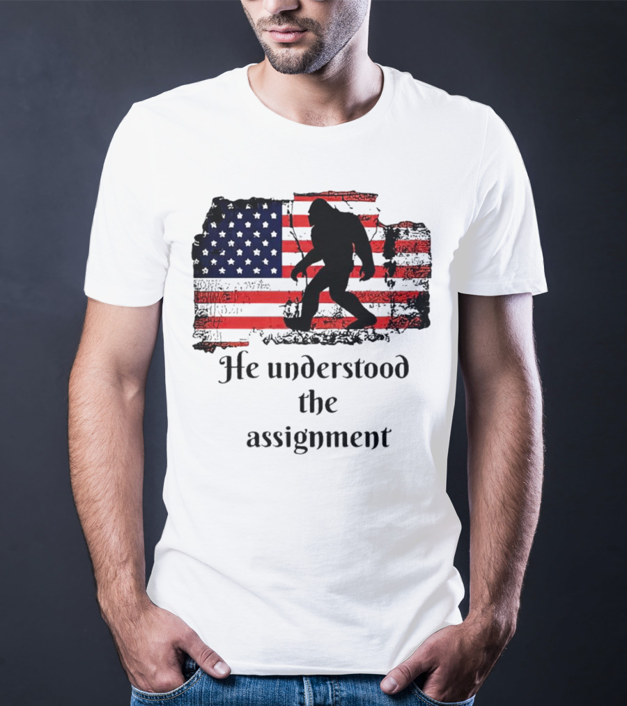 Bigfoot Silhouette With Distressed American Flag He Understood The Assignment T-Shirt