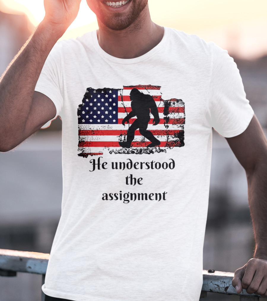 Bigfoot Silhouette With Distressed American Flag He Understood The Assignment T-Shirt
