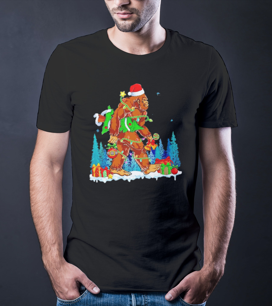 Bigfoot Santa Hugging Christmas Tree With Gifts And Snow Scene T-Shirt