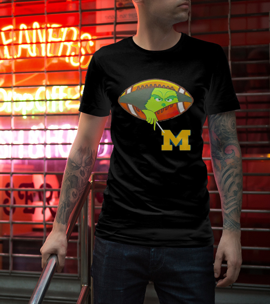 Grinch Peeking From Football Over Michigan Wolverines T-Shirt
