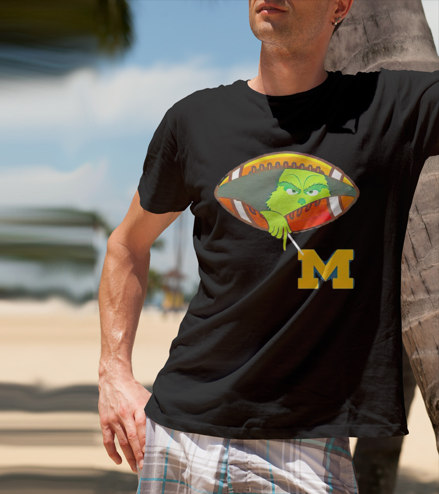 Grinch Peeking From Football Over Michigan Wolverines T-Shirt