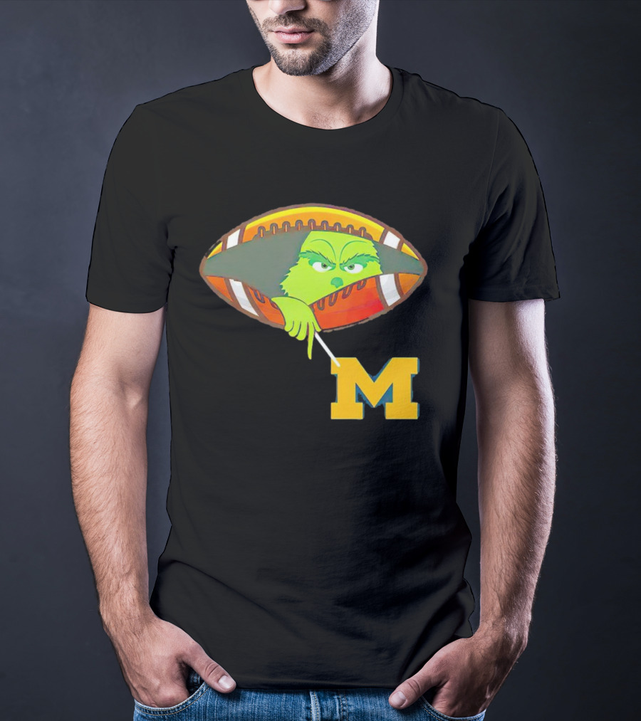 Grinch Peeking From Football Over Michigan Wolverines T-Shirt