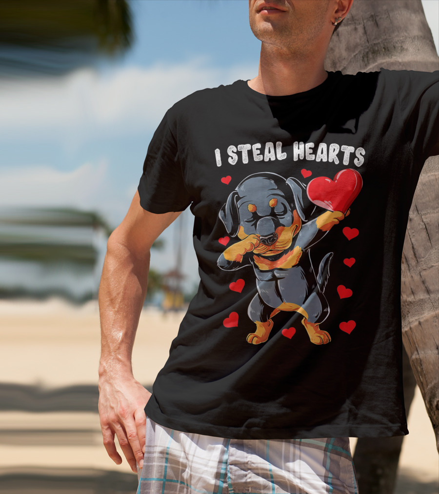 Dabbing Rottweiler Holding Heart Surrounded By I Steal Hearts Text T-Shirt