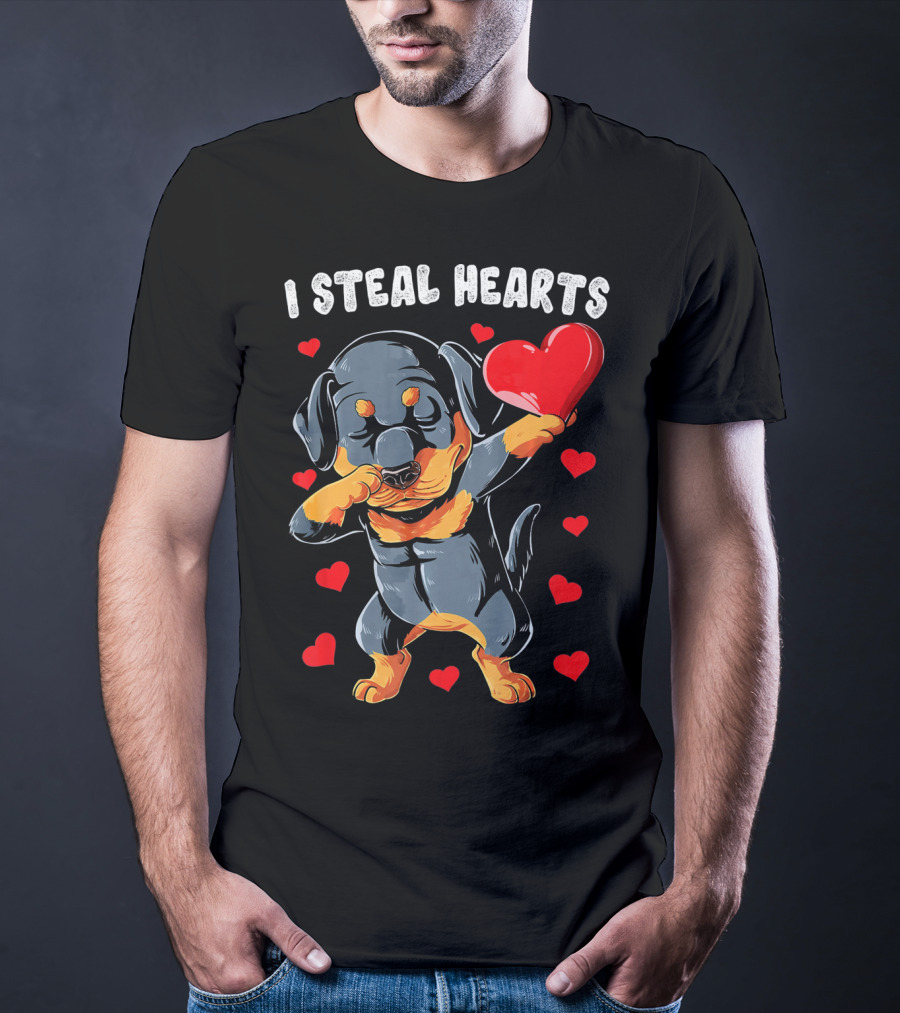 Dabbing Rottweiler Holding Heart Surrounded By I Steal Hearts Text T-Shirt