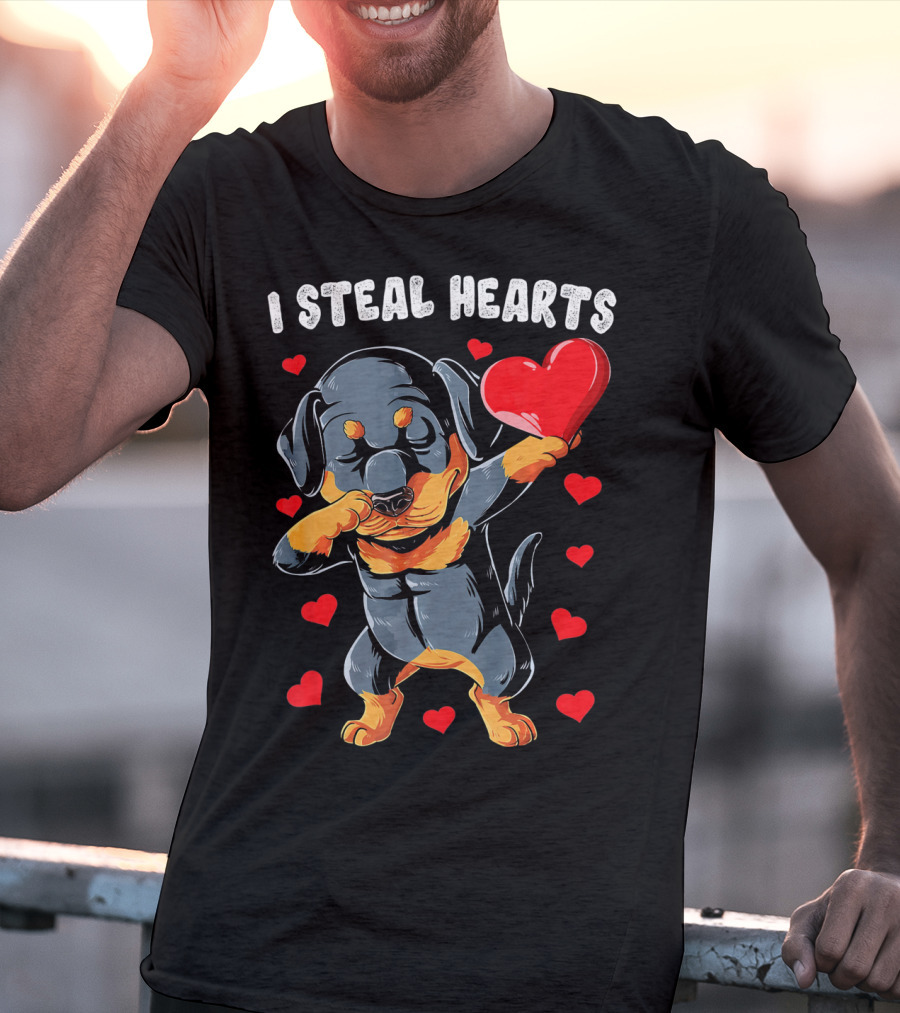 Dabbing Rottweiler Holding Heart Surrounded By I Steal Hearts Text T-Shirt