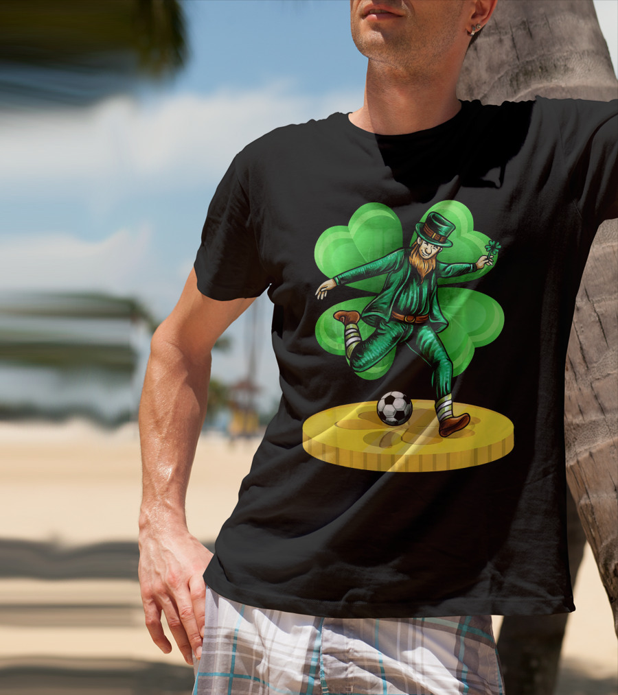 Leprechaun Kicking Soccer Ball On Gold Coin With Shamrock Background T-Shirt
