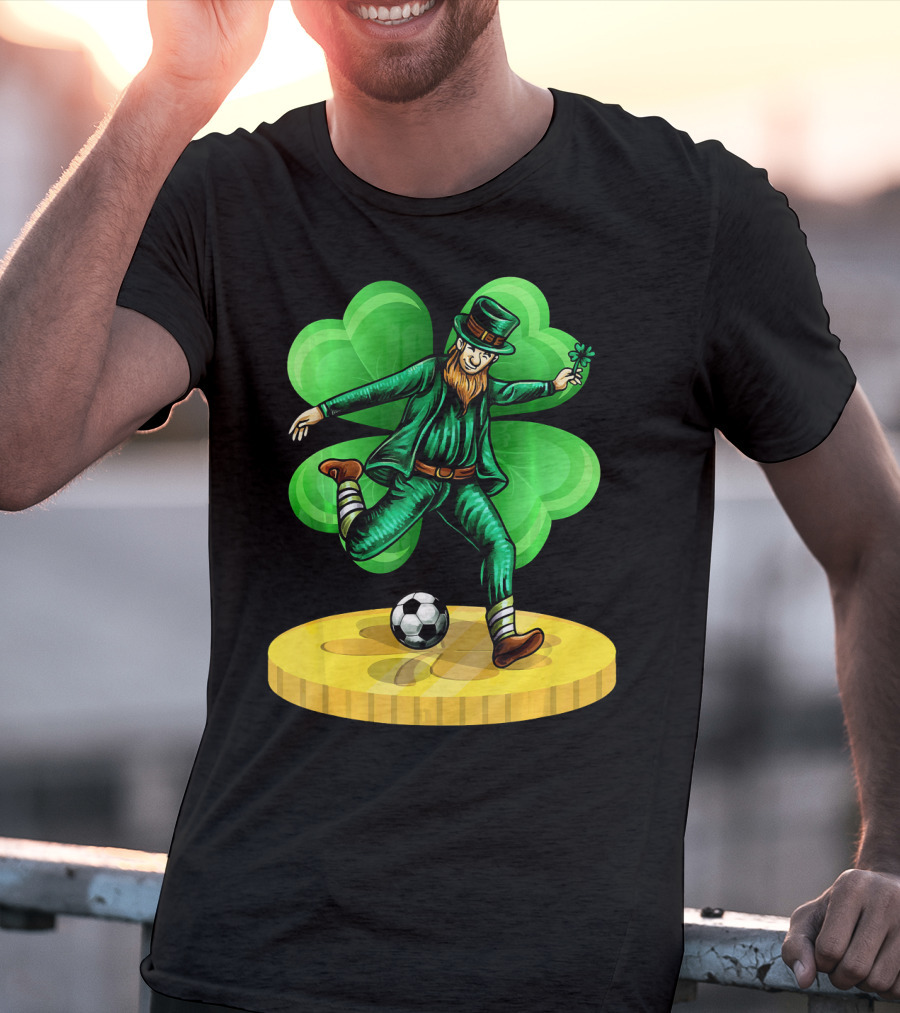 Leprechaun Kicking Soccer Ball On Gold Coin With Shamrock Background T-Shirt