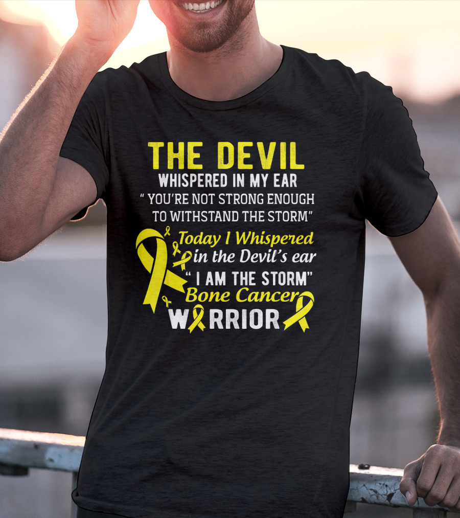 The Devil Whispered You’re Not Strong Enough To Withstand The Storm I Am The Storm Bone Cancer Warrior Yellow T-Shirt