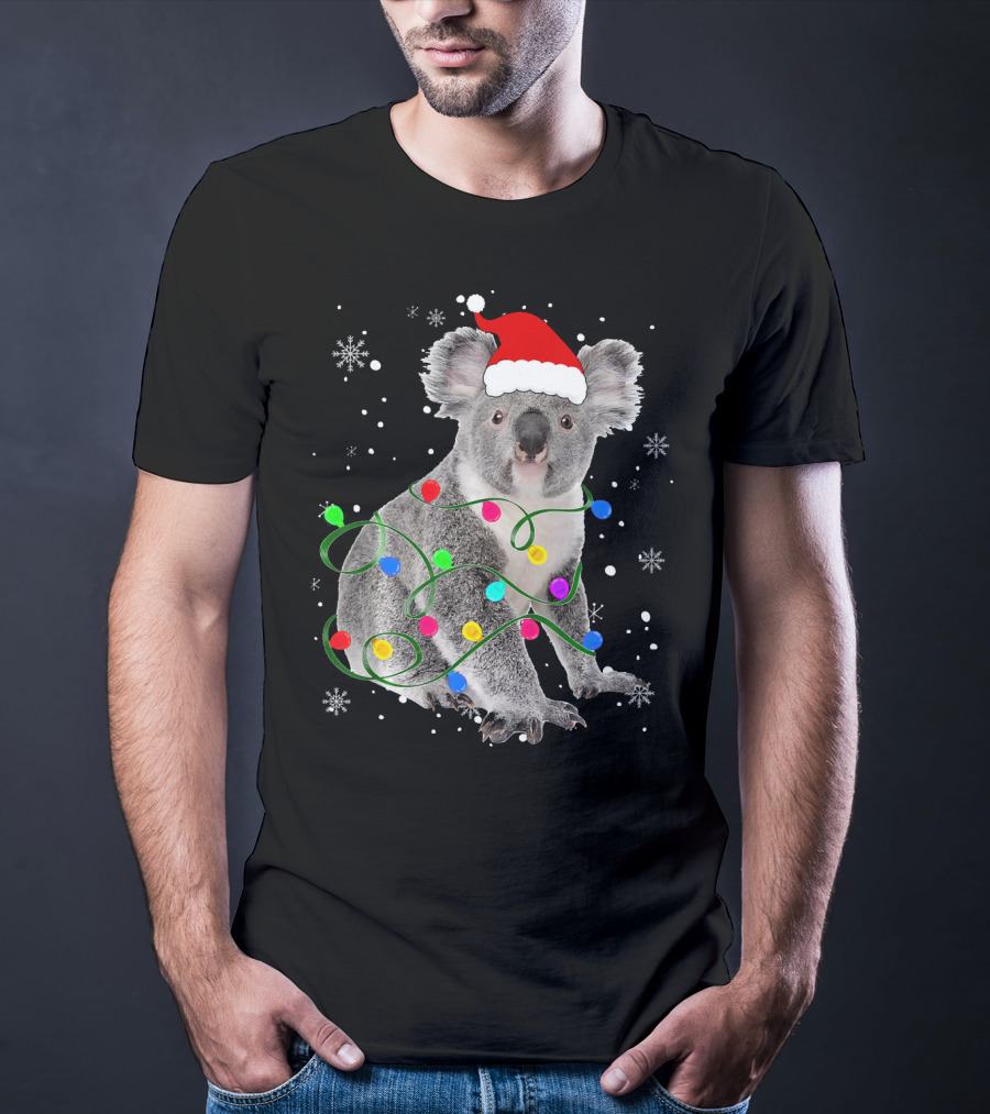Koala Wrapped In Christmas Lights Wearing Santa Hat With Snowflakes Matching Fam T-Shirt