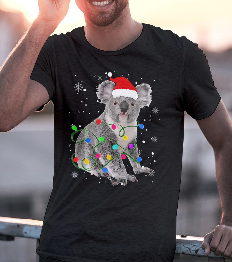 Koala Wrapped In Christmas Lights Wearing Santa Hat With Snowflakes Matching Fam T-Shirt