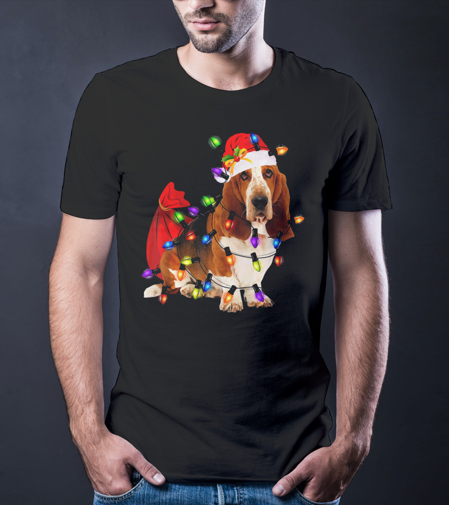 Basset Hound Wrapped In Christmas Lights With Santa Hat And Red Sack T-Shirt