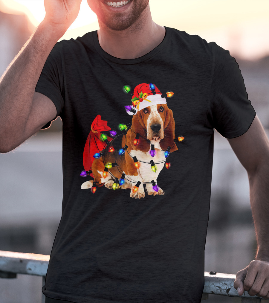 Basset Hound Wrapped In Christmas Lights With Santa Hat And Red Sack T-Shirt