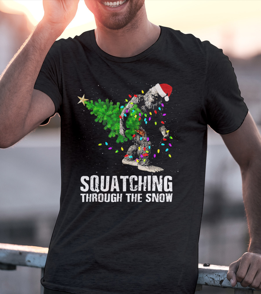 Squatching Through The Snow Bigfoot Christmas Lights Santa Hat T-Shirt