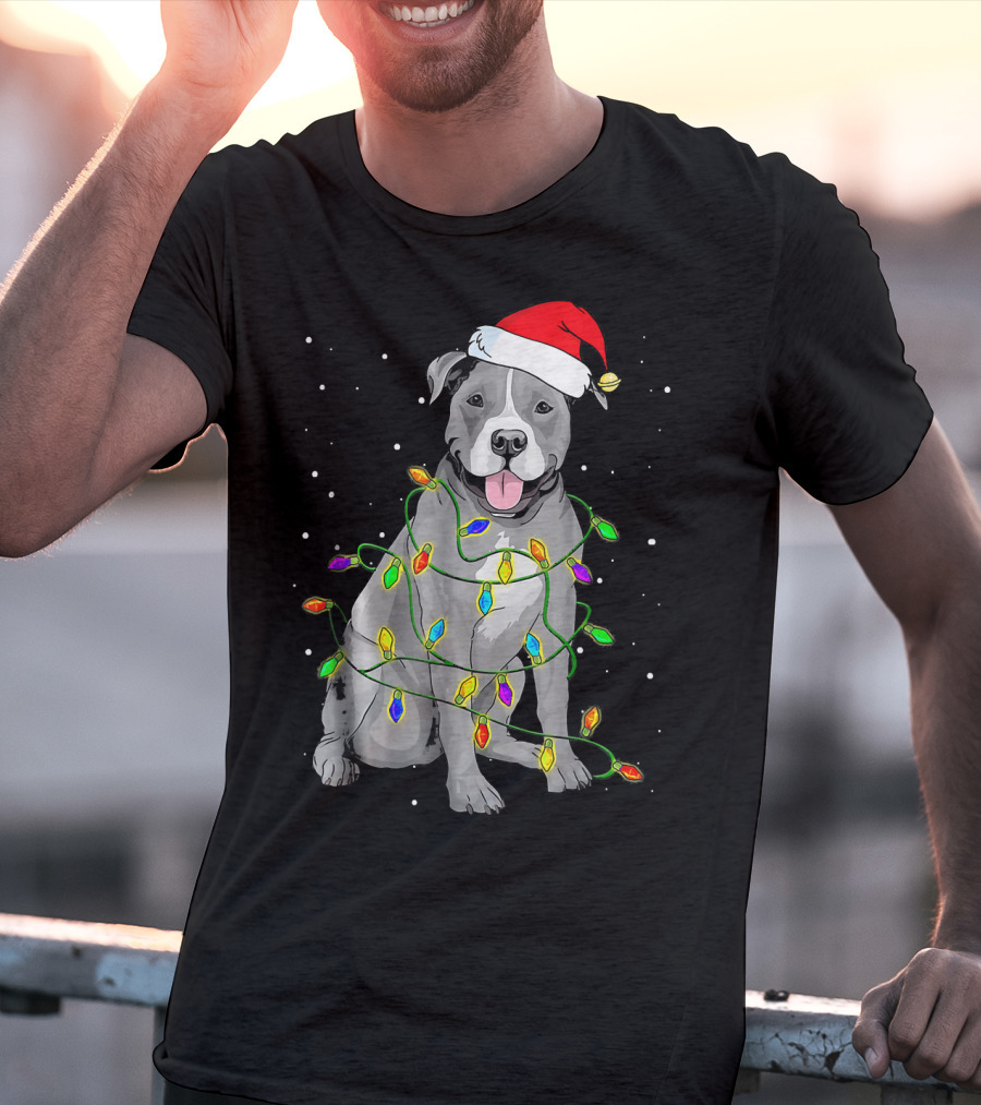 Pitbull In Santa Hat Wrapped In Christmas Lights With Snowy Background T-Shirt