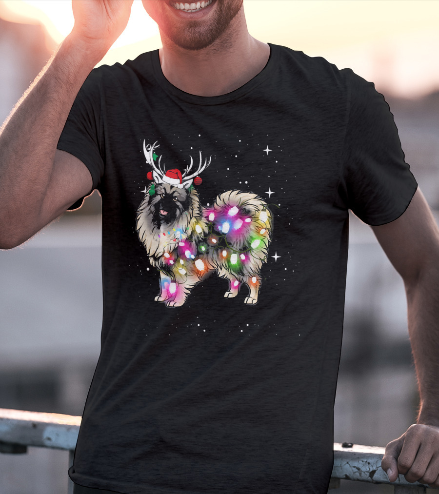 Keeshond Dog Wrapped In Christmas Lights Wearing Red Santa Hat And Antlers T-Shirt