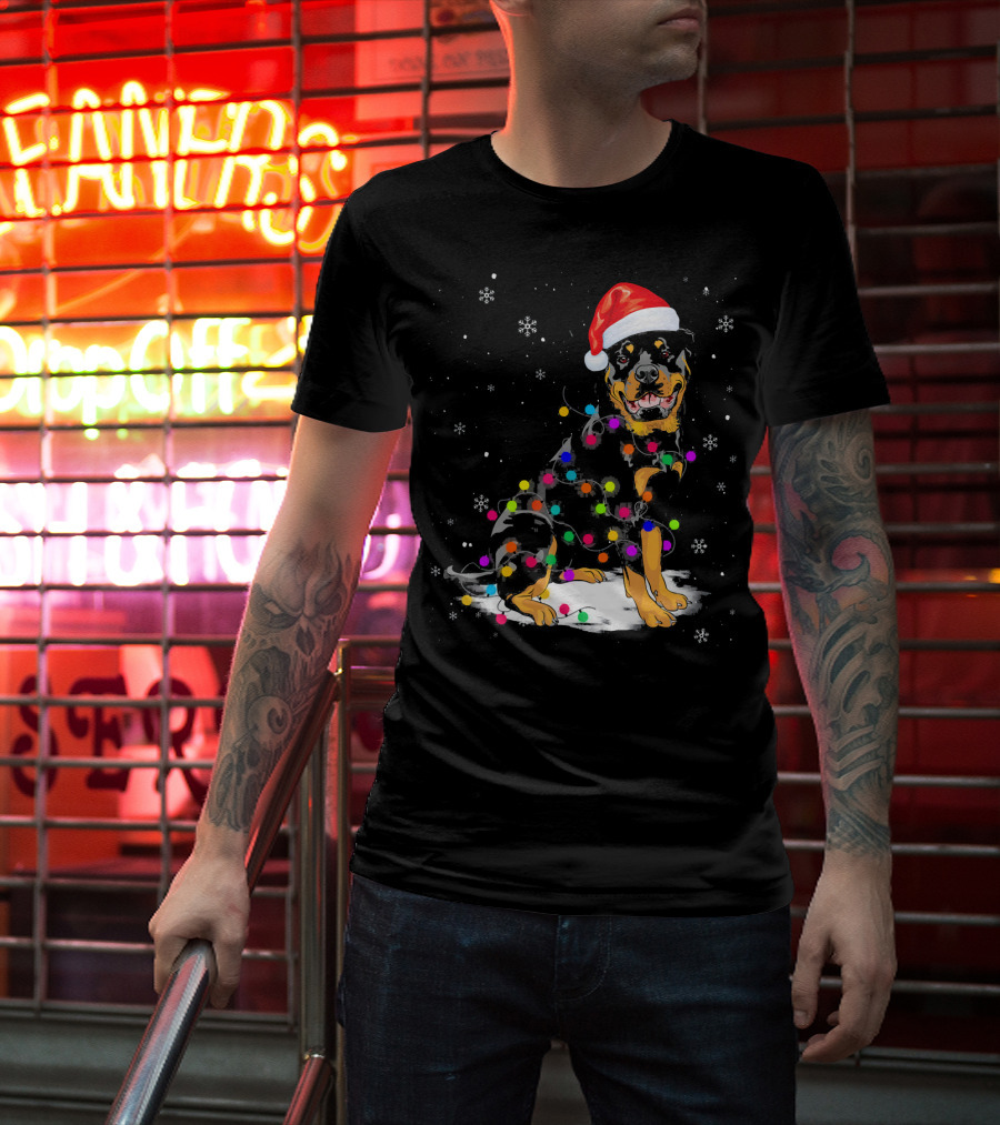 Rottweiler With Santa Hat And Colorful Christmas Lights In Snowy Scene T-Shirt