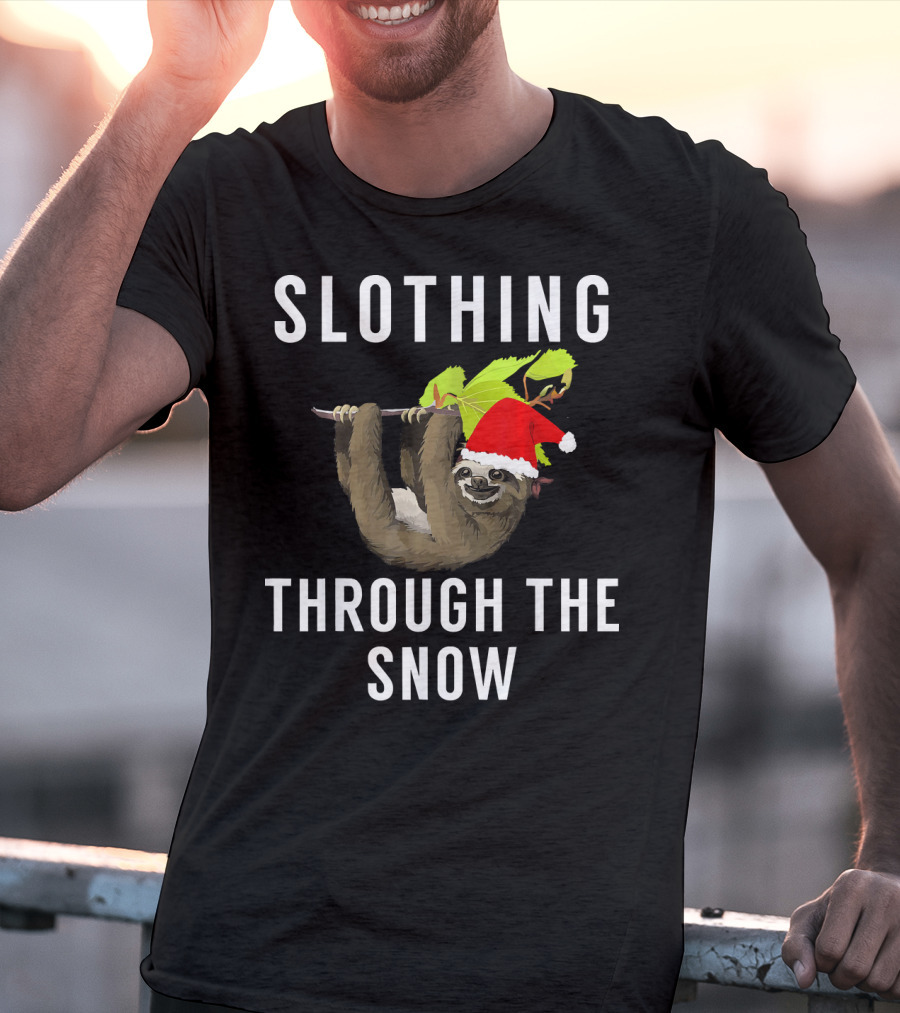 Sloth Wearing Santa Hat Hanging On Branch With Slothing Through The Snow T-Shirt