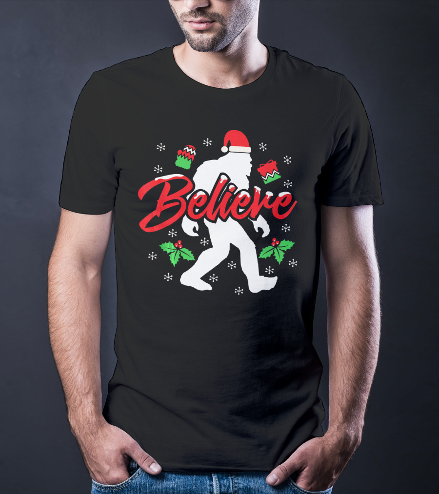 Believe Bigfoot Christmas Santa Hat Snowflakes Holly T-Shirt