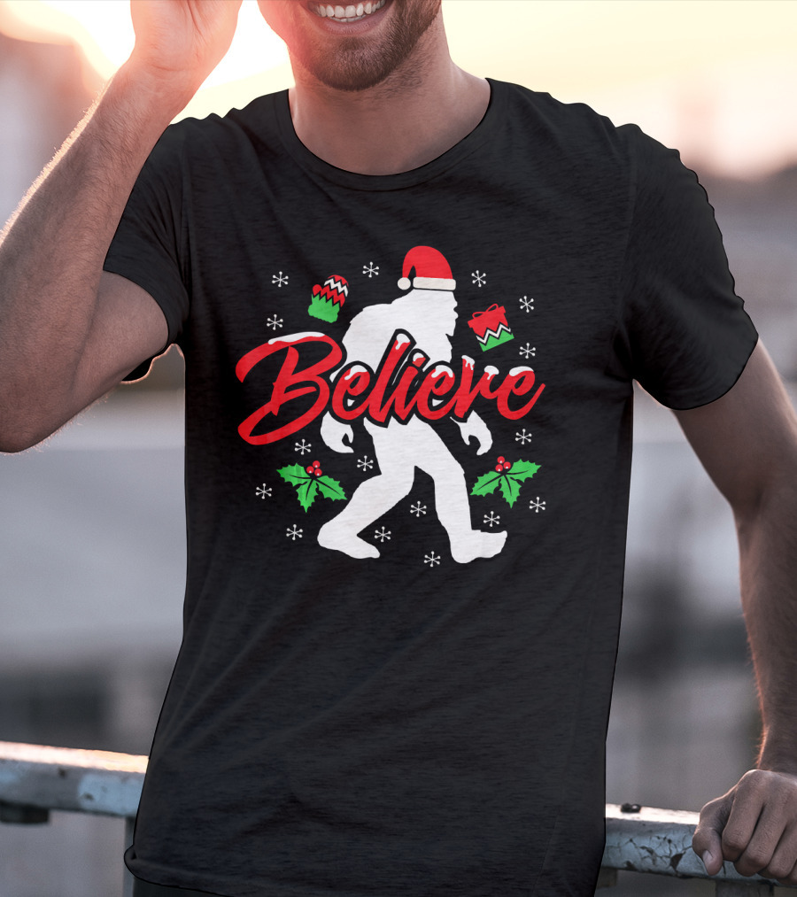 Believe Bigfoot Christmas Santa Hat Snowflakes Holly T-Shirt