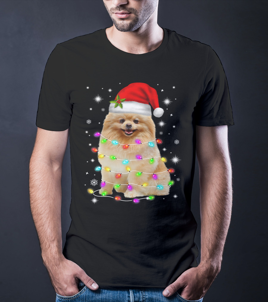 Pomeranian Pup Wrapped In Christmas Lights With Santa Hat And Festive Glow T-Shirt