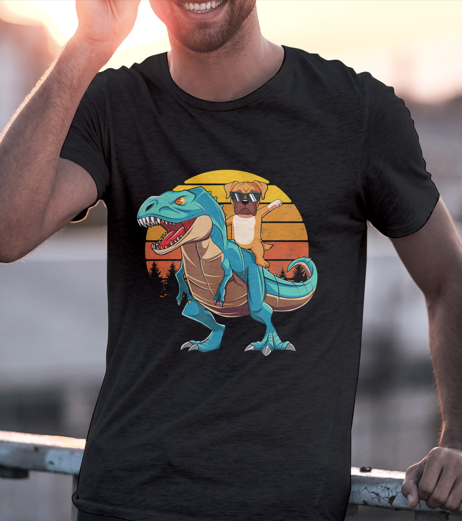 Boxer Dog With Sunglasses Riding Blue T-Rex Against Sunset Background T-Shirt